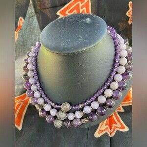 Three strand necklace, amethyst, round beads with bali silver accents and clasp.